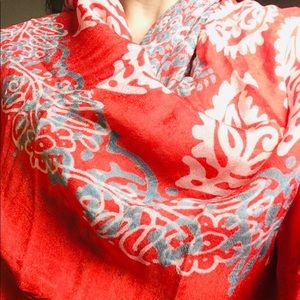 Very light red scarf with white flower